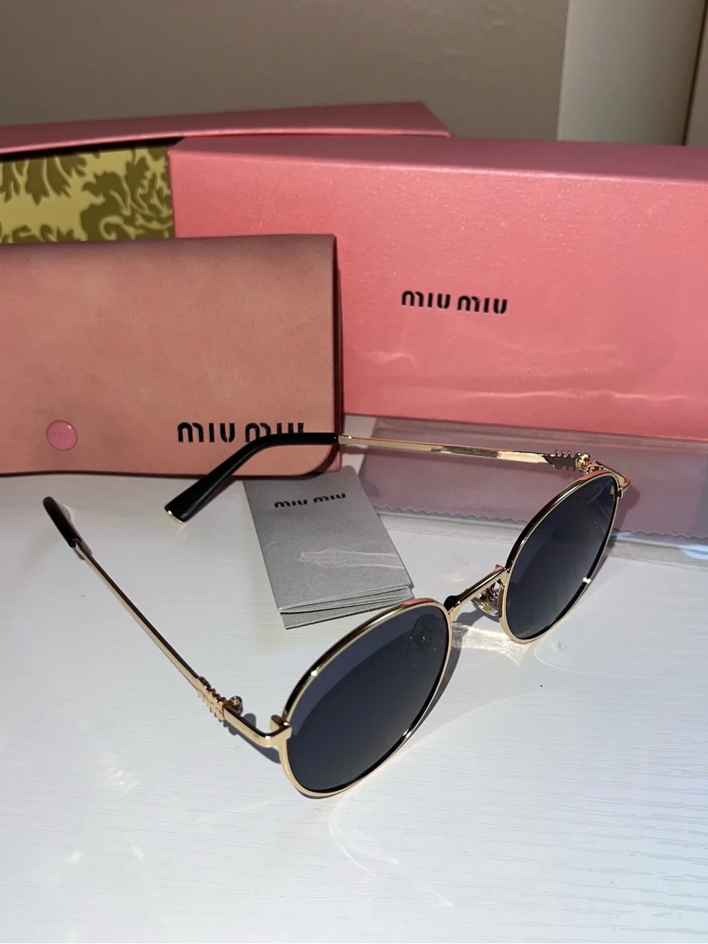 Miu Miu Gold Metal Round Sunglasses with Black Lenses
